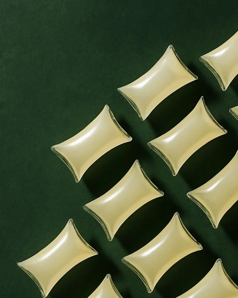 Multiple adhesives arranged on a dark green surface.